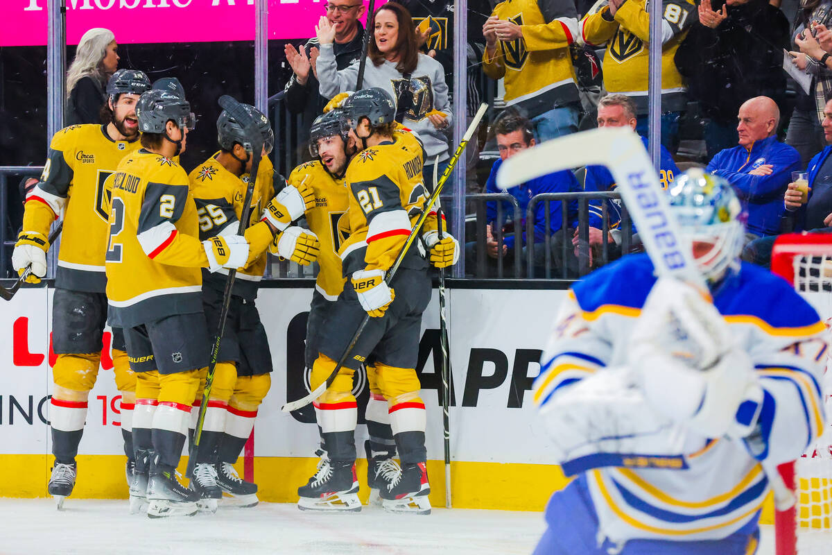 The Golden Knights celebrate a goal during an NHL hockey game between the Golden Knights and Bu ...