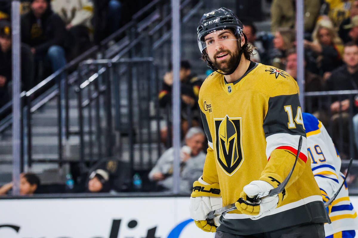 Golden Knights defenseman Nicolas Hague (14) smiles during an NHL hockey game between the Golde ...