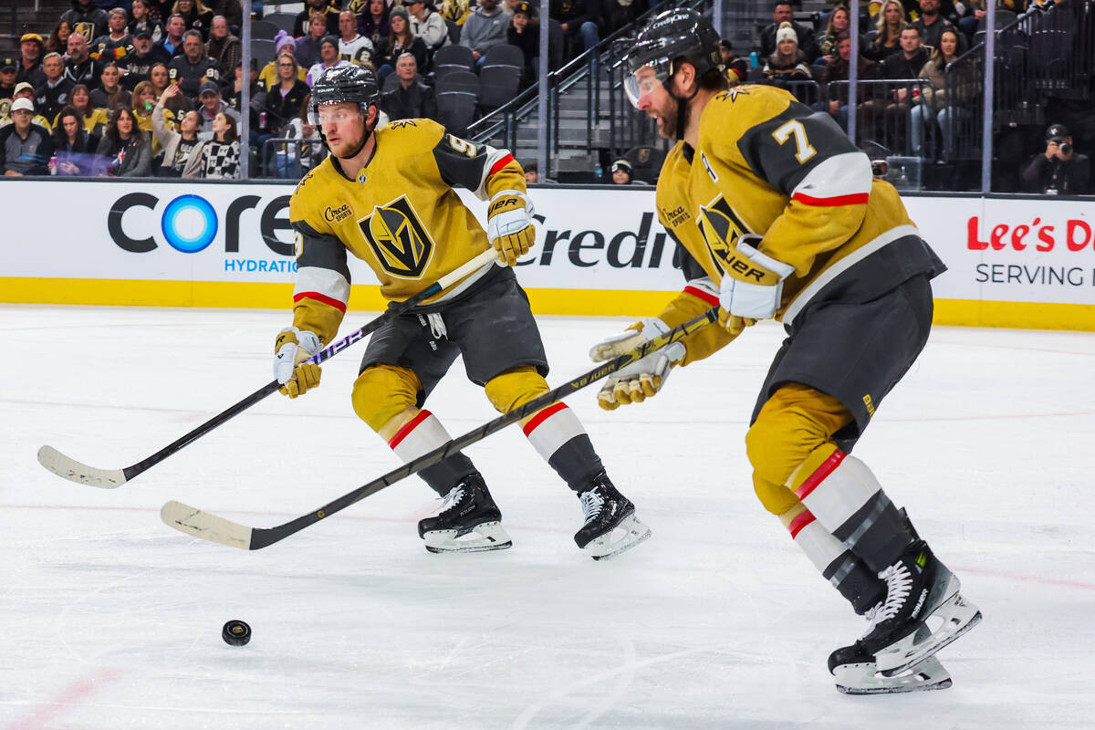 Golden Knights center Jack Eichel (9) skates alongside Golden Knights defenseman Alex Pietrange ...