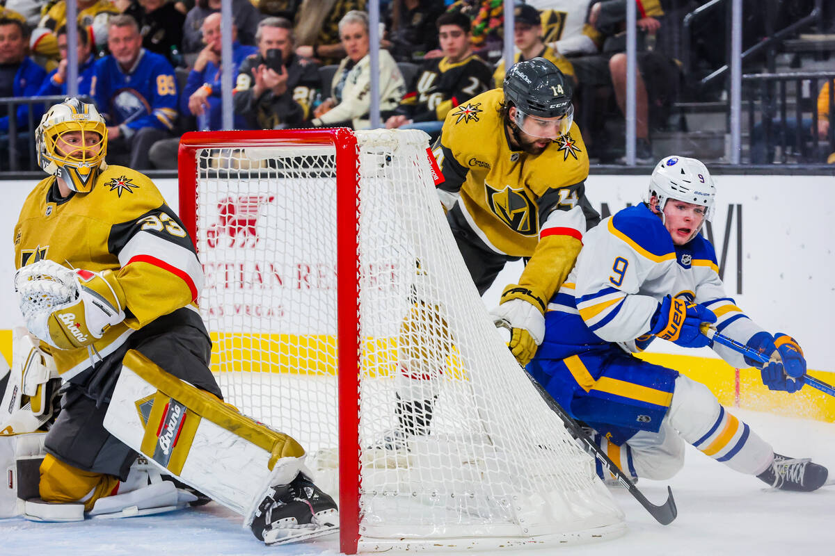 Buffalo Sabres left wing Zach Benson (9) loses his balance in a rush for the puck during an NHL ...