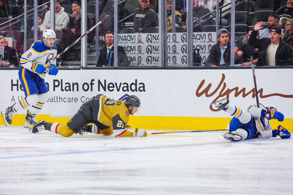 Buffalo Sabres right wing Jack Quinn (22) and Golden Knights center Brett Howden (21) lose thei ...