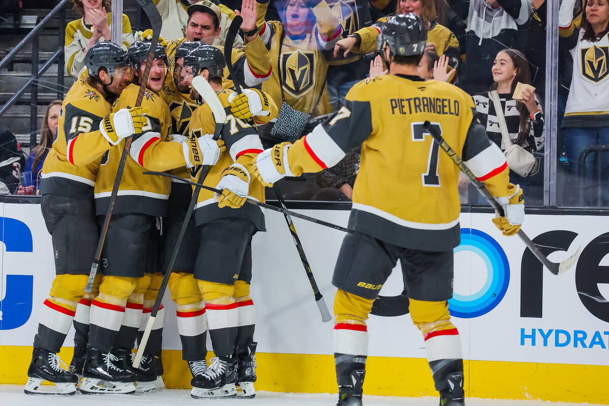 Golden Knights teammates celebrate a goal during an NHL hockey game between the Golden Knights ...