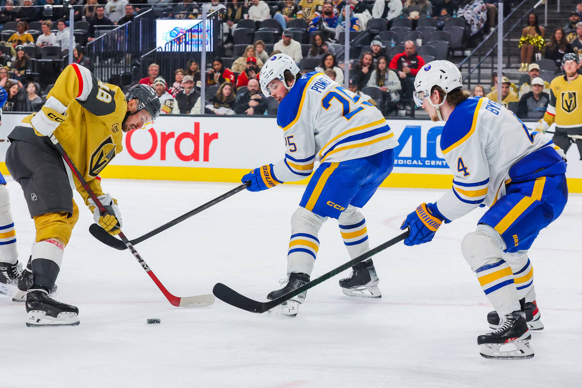 Golden Knights center Tomas Hertl (48) rushes the puck forward as he meets Buffalo Sabres defen ...