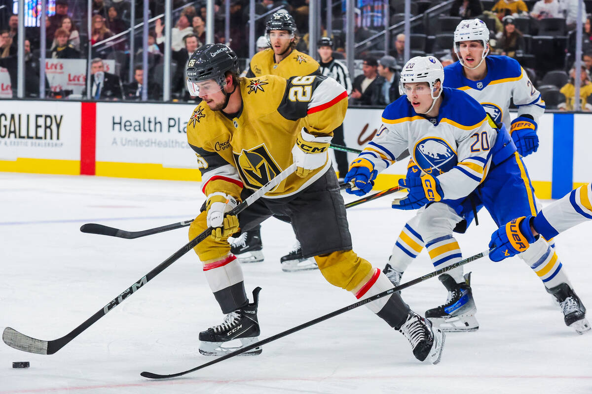 Golden Knights right wing Alexander Holtz (26) rushes the puck during an NHL hockey game betwee ...