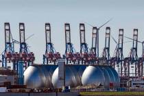 Tanks for producing bio gas are pictured at the harbor in Hamburg, Germany. (AP Photo/Martin Me ...