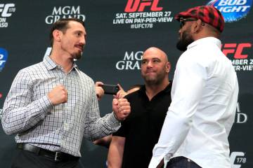 Tim Kennedy, left, and Yoel Romero face off during media day in advance of UFC 178 Thursday, Se ...