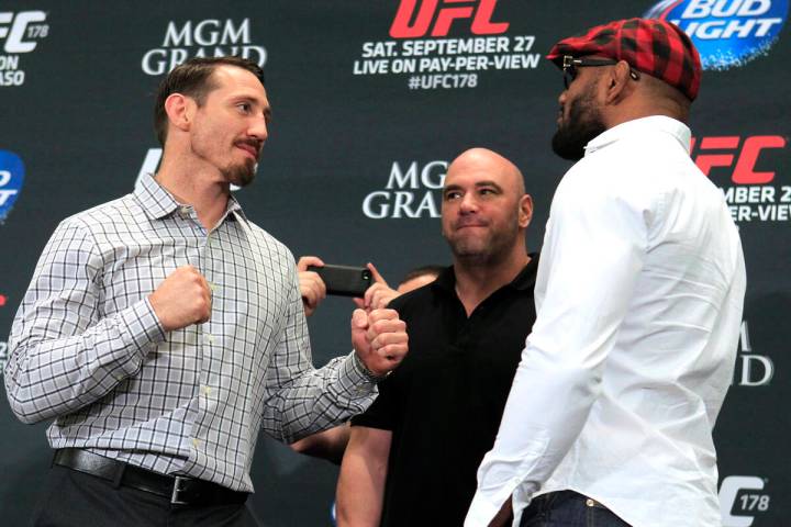 Tim Kennedy, left, and Yoel Romero face off during media day in advance of UFC 178 Thursday, Se ...