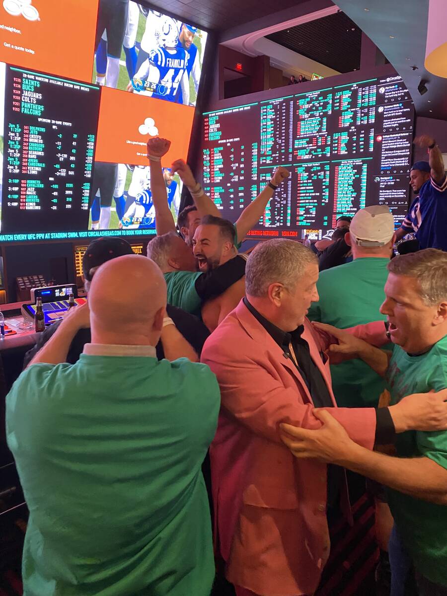 Team Meatball Brothers celebrates with Circa owner Derek Stevens, center in jacket, after winni ...