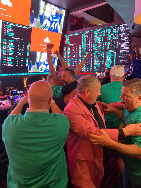 Team Meatball Brothers celebrates with Circa owner Derek Stevens, center in jacket, after winni ...