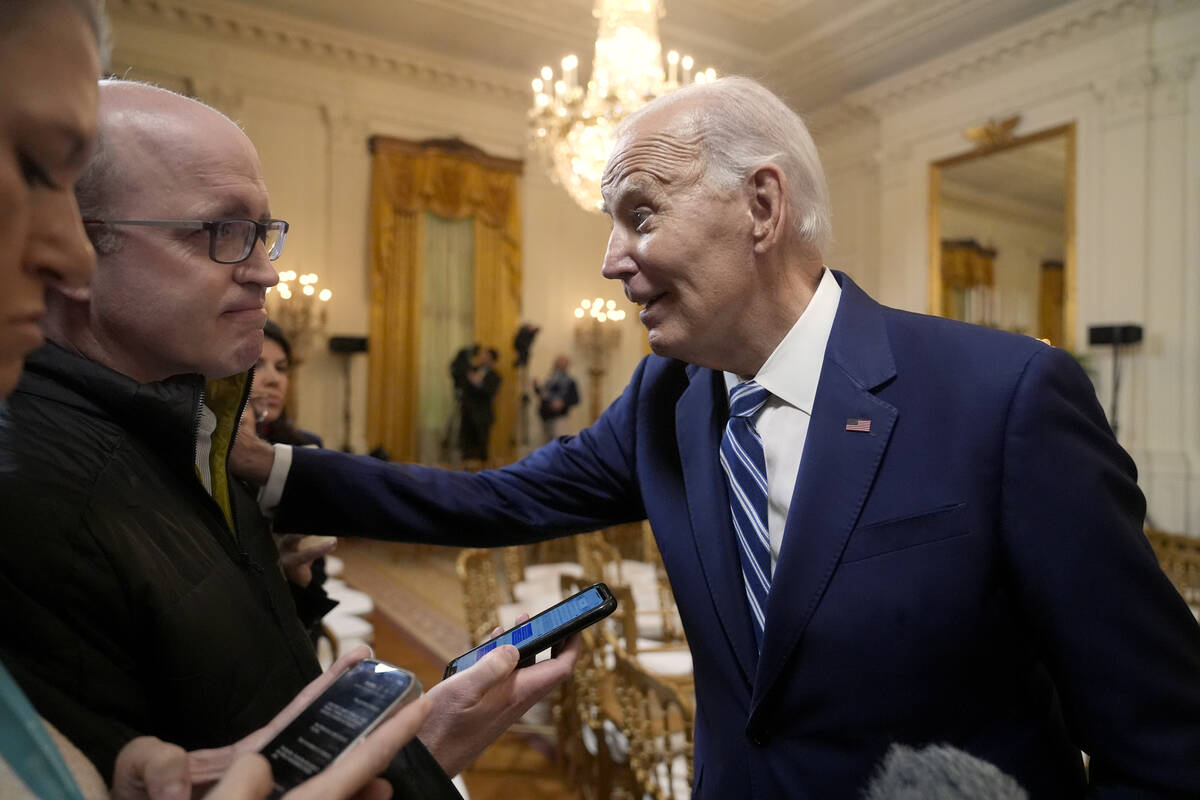 President Joe Biden speaks with reporters after signing the Social Security Fairness Act in the ...