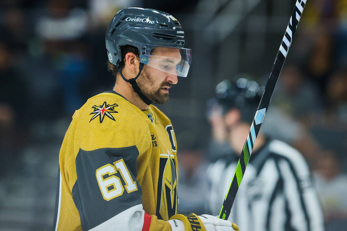 Golden Knights right wing Mark Stone (61) looks at his hockey stick during the third period of ...