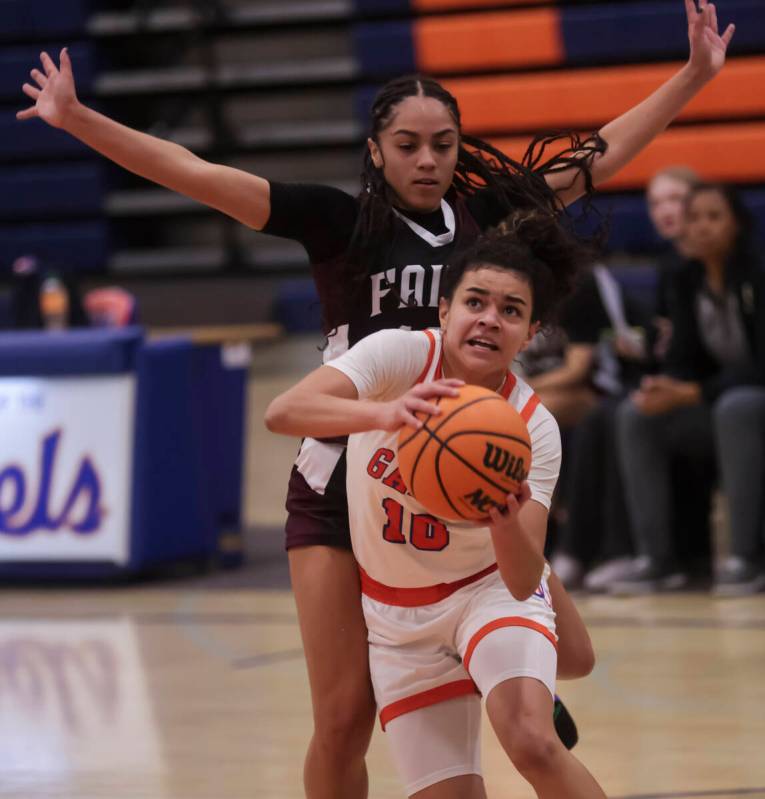 Bishop Gorman's Aaliah Spaight (10) drives to the basket past Faith Lutheran during a high scho ...