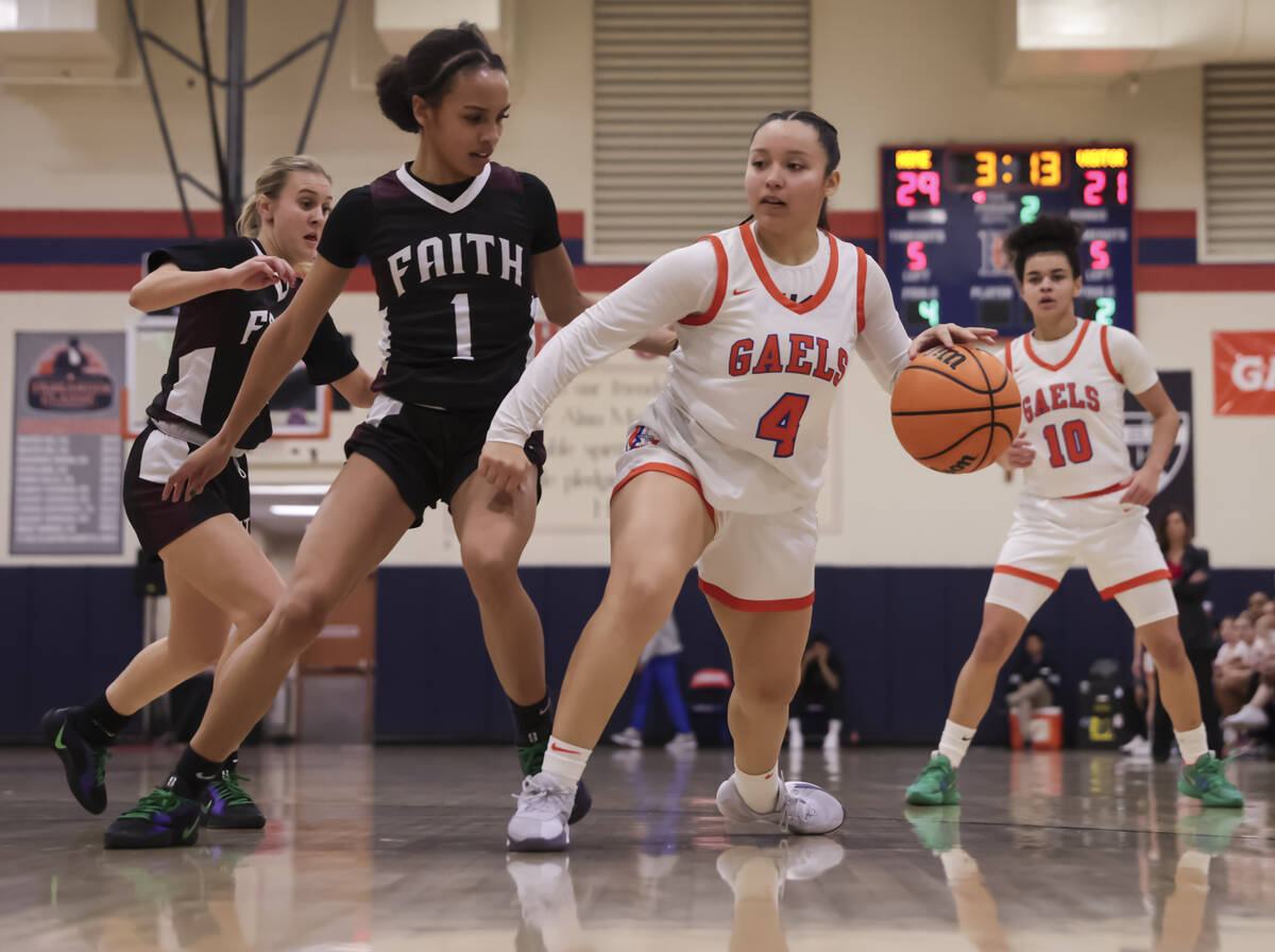 Bishop Gorman's Anna Barragan (4) drives to the basket against Faith Lutheran's Jasmyn Jackson ...