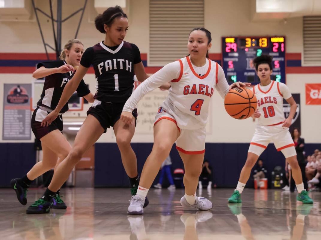 Bishop Gorman's Anna Barragan (4) drives to the basket against Faith Lutheran's Jasmyn Jackson ...