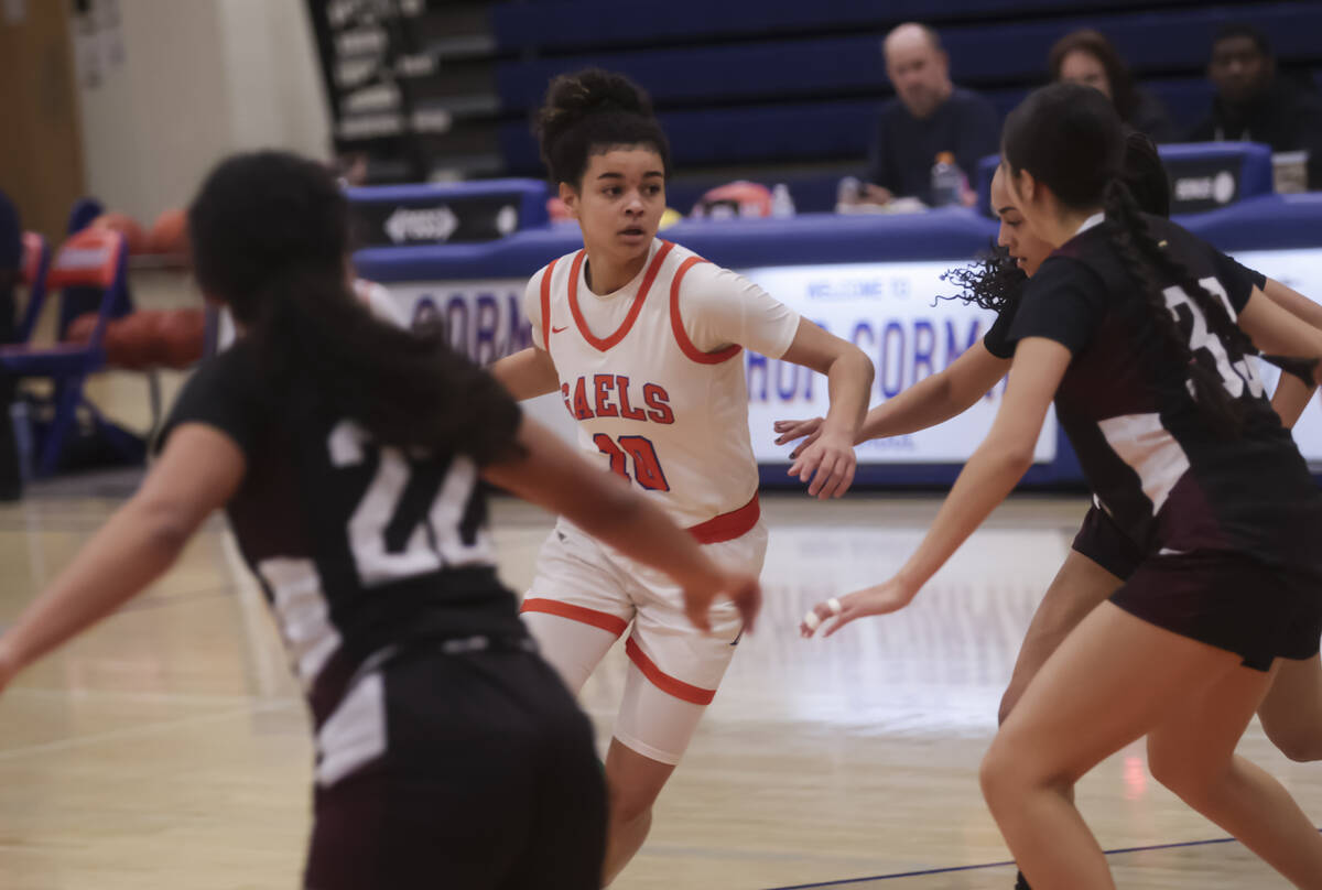 Bishop Gorman's Aaliah Spaight (10) drives the ball against Faith Lutheran during a high school ...