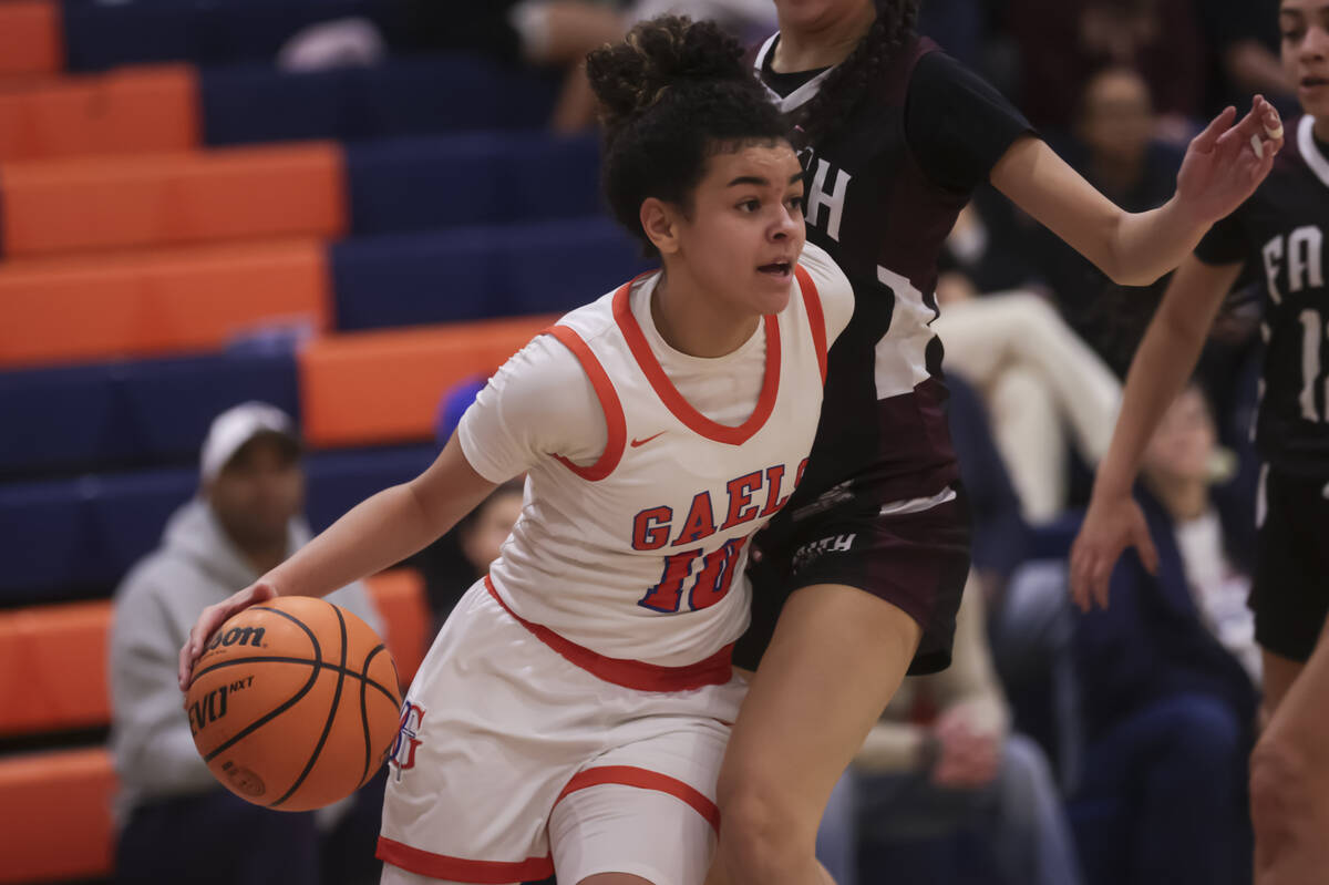 Bishop Gorman's Aaliah Spaight (10) drives the ball against Faith Lutheran's guard Emma Herpin ...