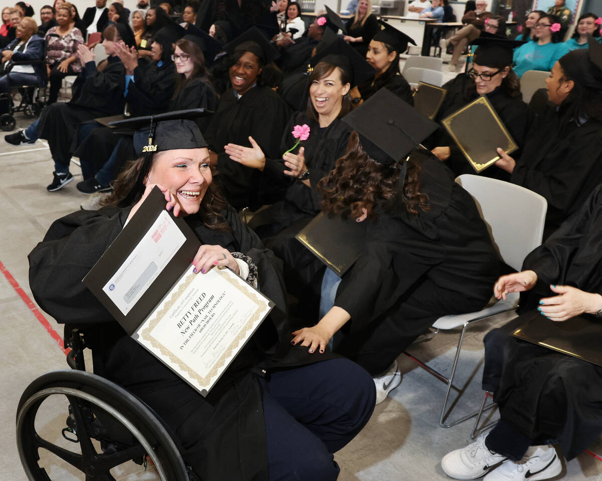 Betty Freed, an inmate at Florence McClure Women’s Correctional Center, receives her nai ...