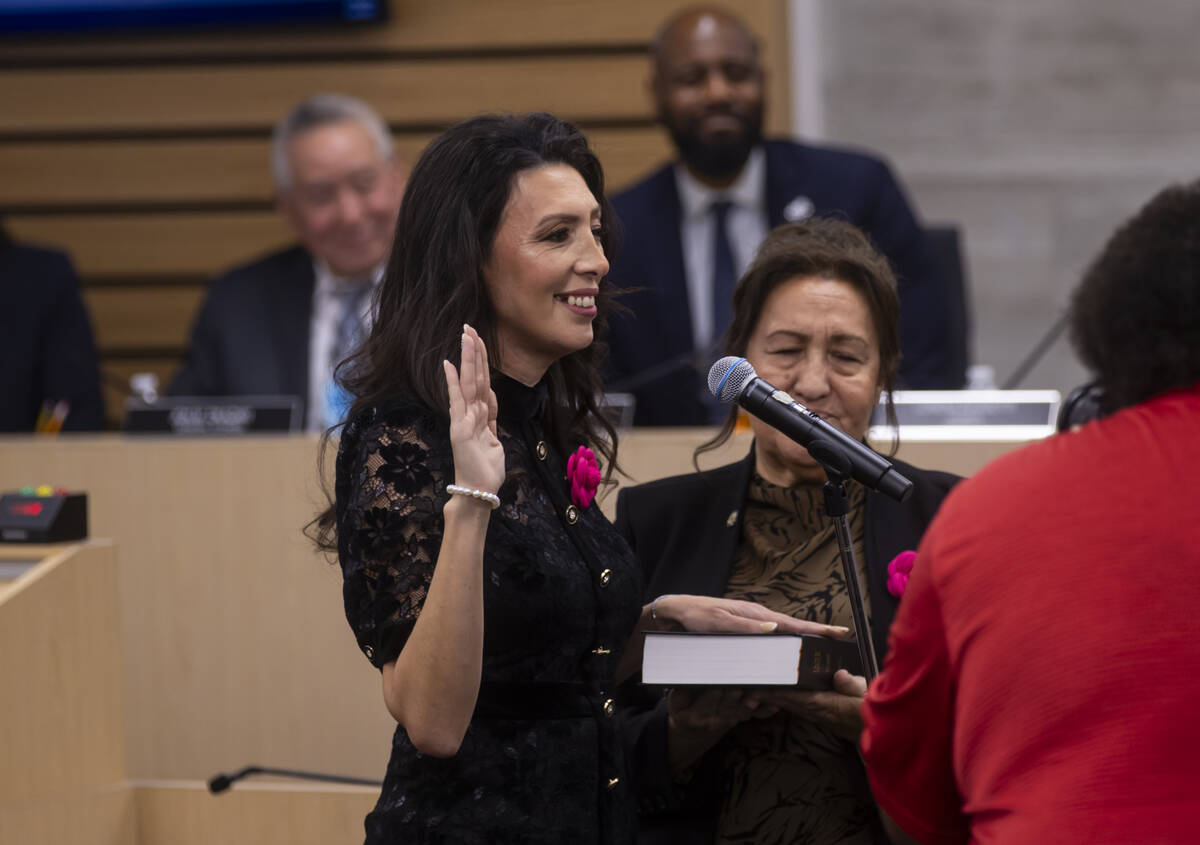 New Clark County School Board trustee Lorena Biassotti is sworn in during a school board meetin ...