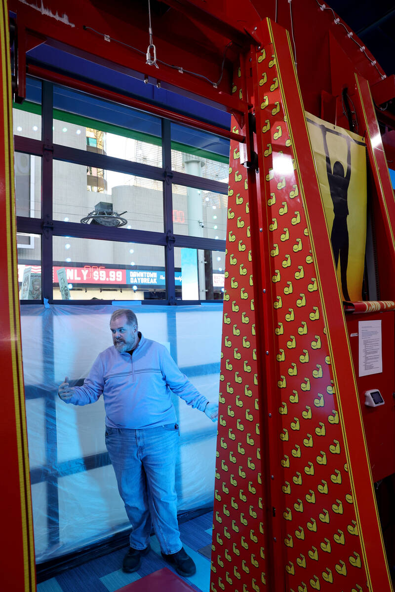 General Manager Chris Coley talks to a reporter about the opening-soon In The Game arcade busin ...