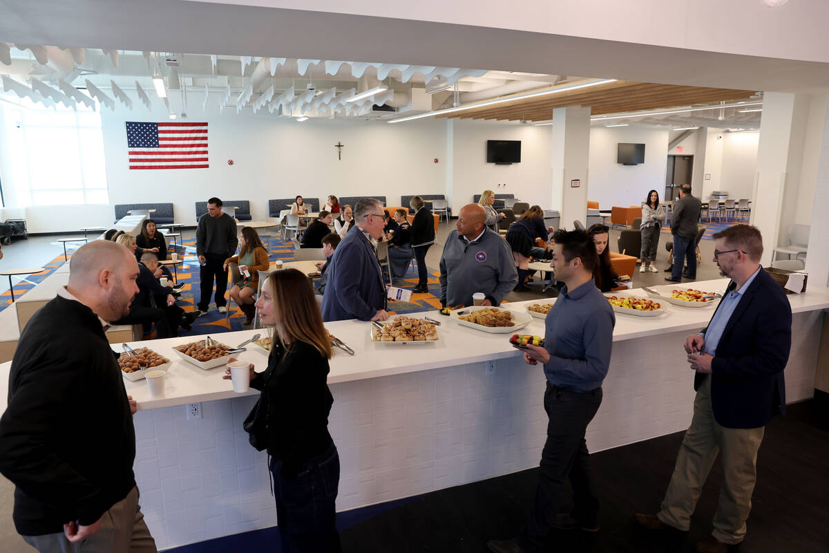 Guests mingle during the opening ceremony for the new Gaughan Family Student Union at Bishop Go ...