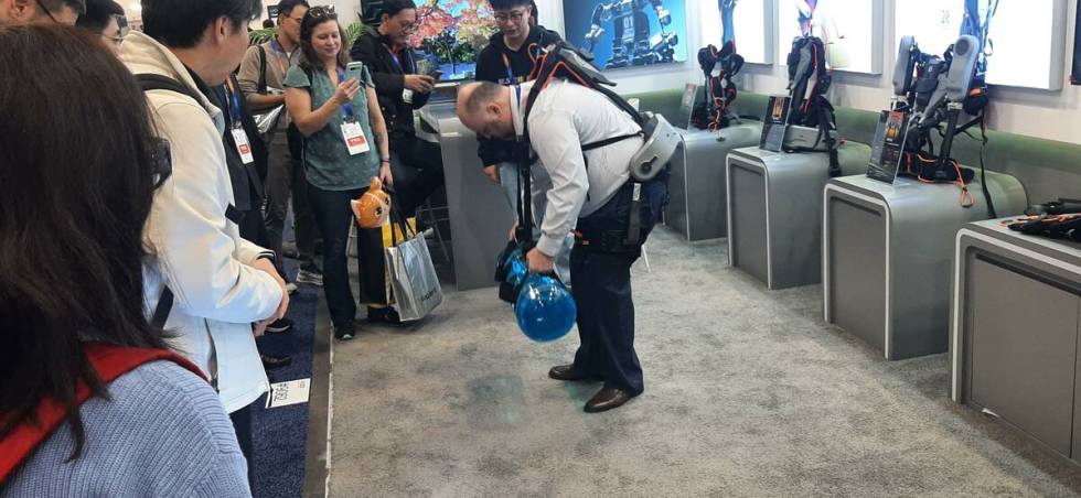 A CES 2025 attendee uses FIT-HV, developed by ULS Robotics, which assists the wearer with lifti ...