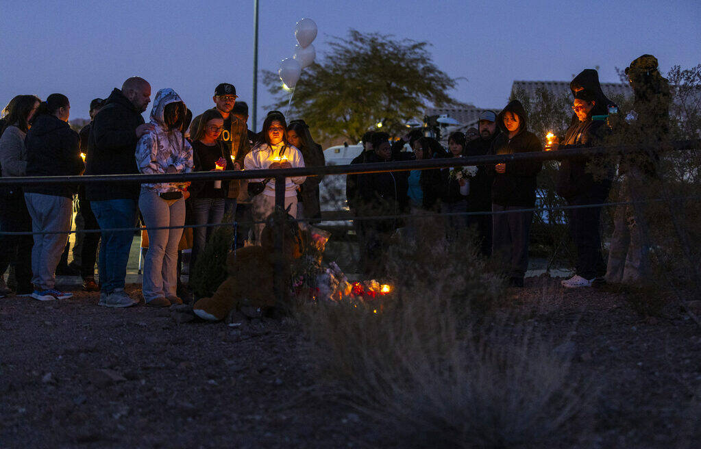 Family and friends gather during a vigil for Jennaleah Hin, 17, who was found dead on Jan. 5, 2 ...