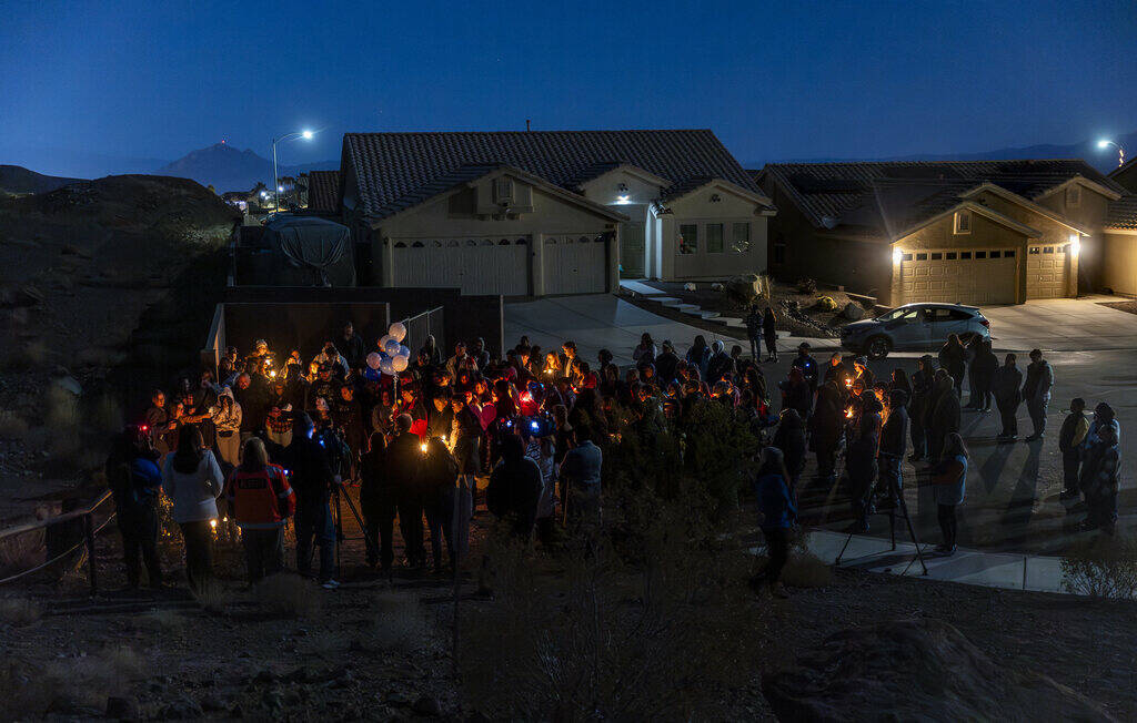 Family and friends gather during a vigil for Jennaleah Hin, 17, who was found dead on Jan. 5, 2 ...