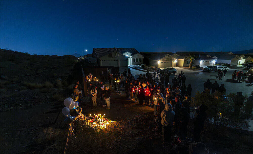 Family and friends gather during a vigil for Jennaleah Hin, 17, who was found dead on Jan. 5, 2 ...