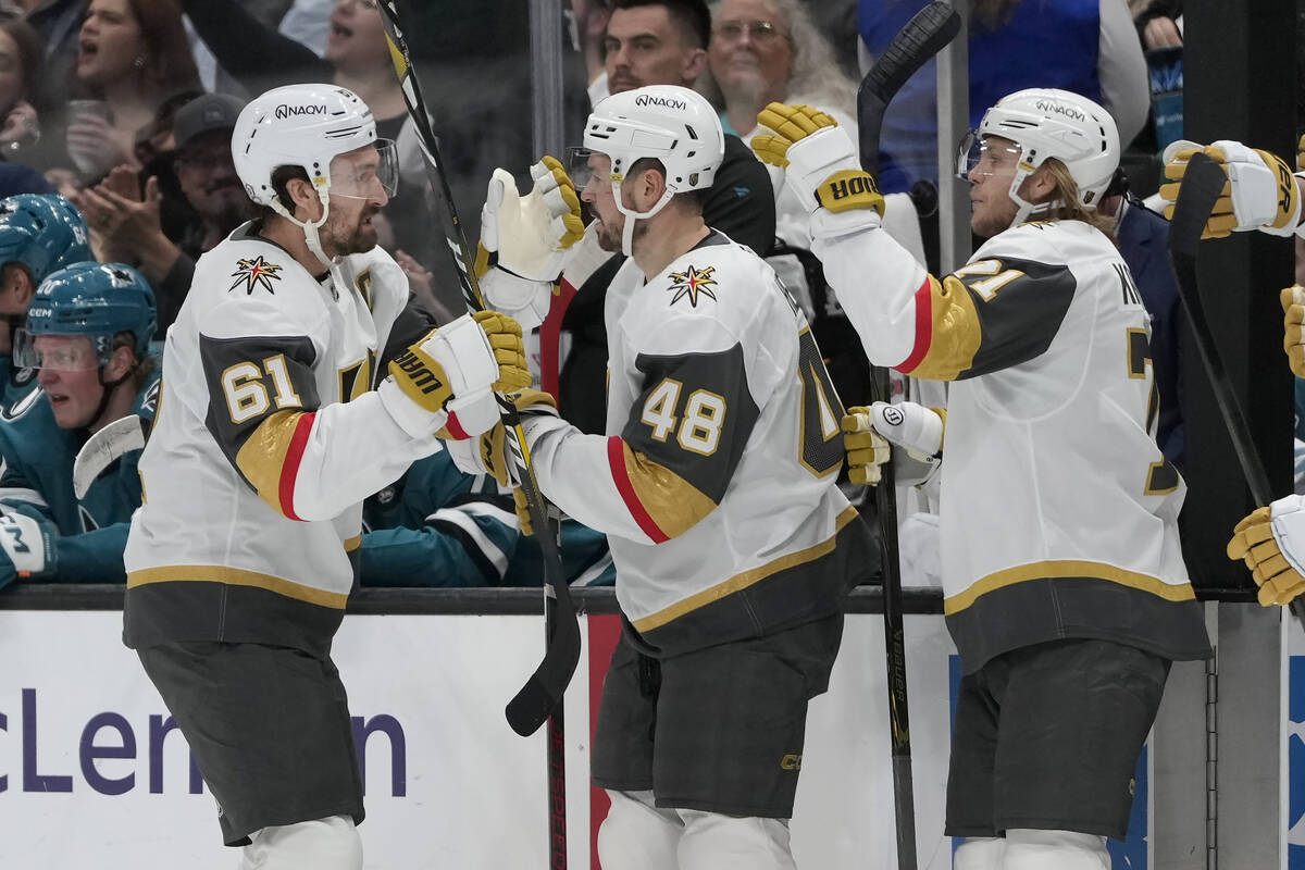 Vegas Golden Knights right wing Mark Stone (61) is congratulated by center Tomas Hertl (48) and ...