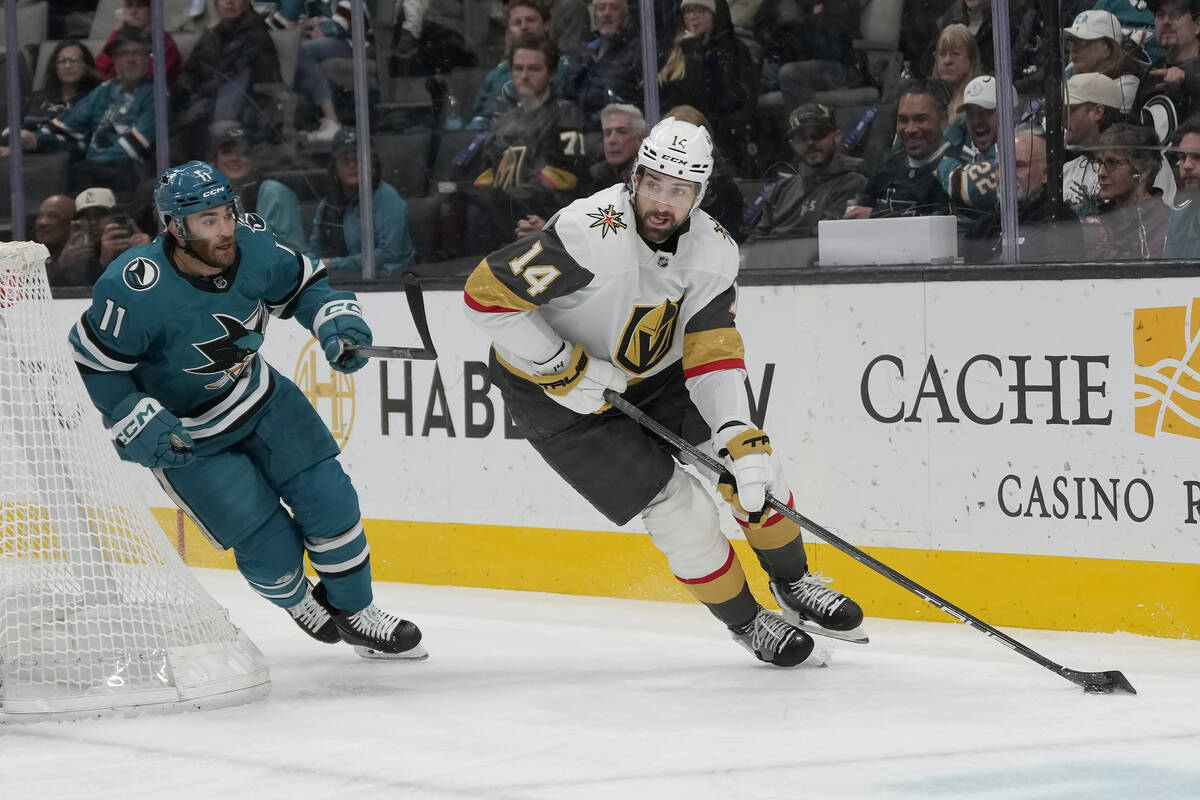 Vegas Golden Knights defenseman Nicolas Hague (14) skates with the puck against San Jose Sharks ...