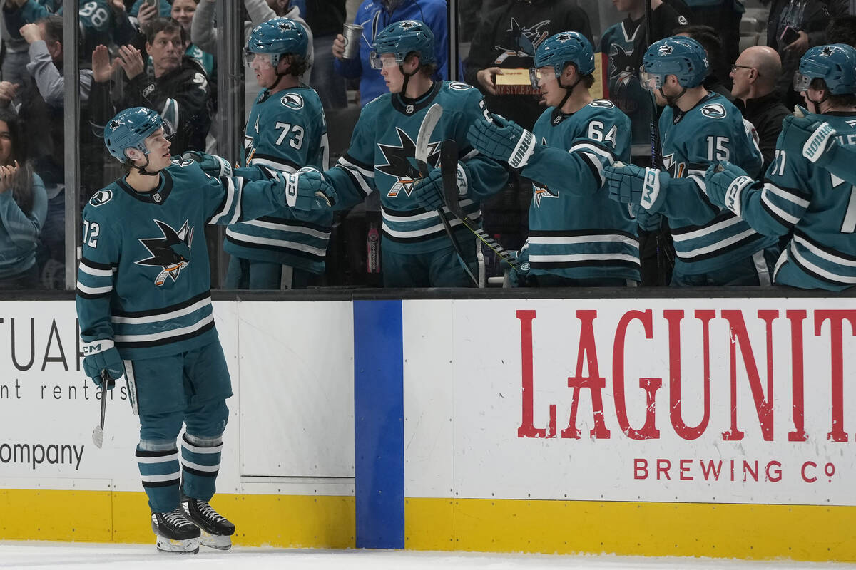 San Jose Sharks left wing William Eklund, left, is congratulated by teammates after scoring aga ...