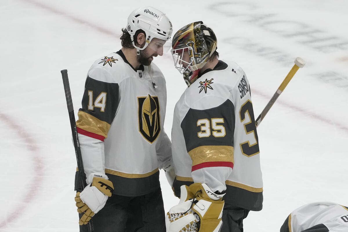 Vegas Golden Knights defenseman Nicolas Hague (14) celebrates with goaltender Ilya Samsonov (35 ...