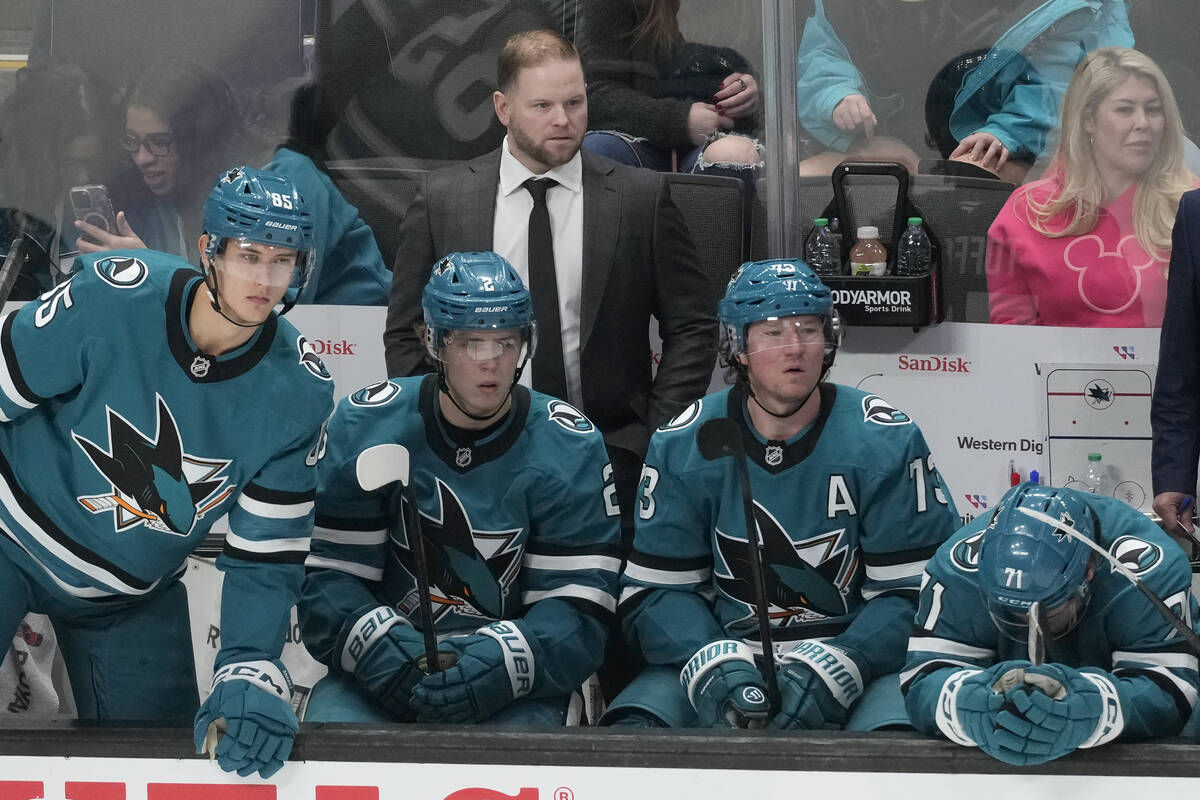 San Jose Sharks head coach Ryan Warsofsky, standing, reacts behind players on the bench during ...