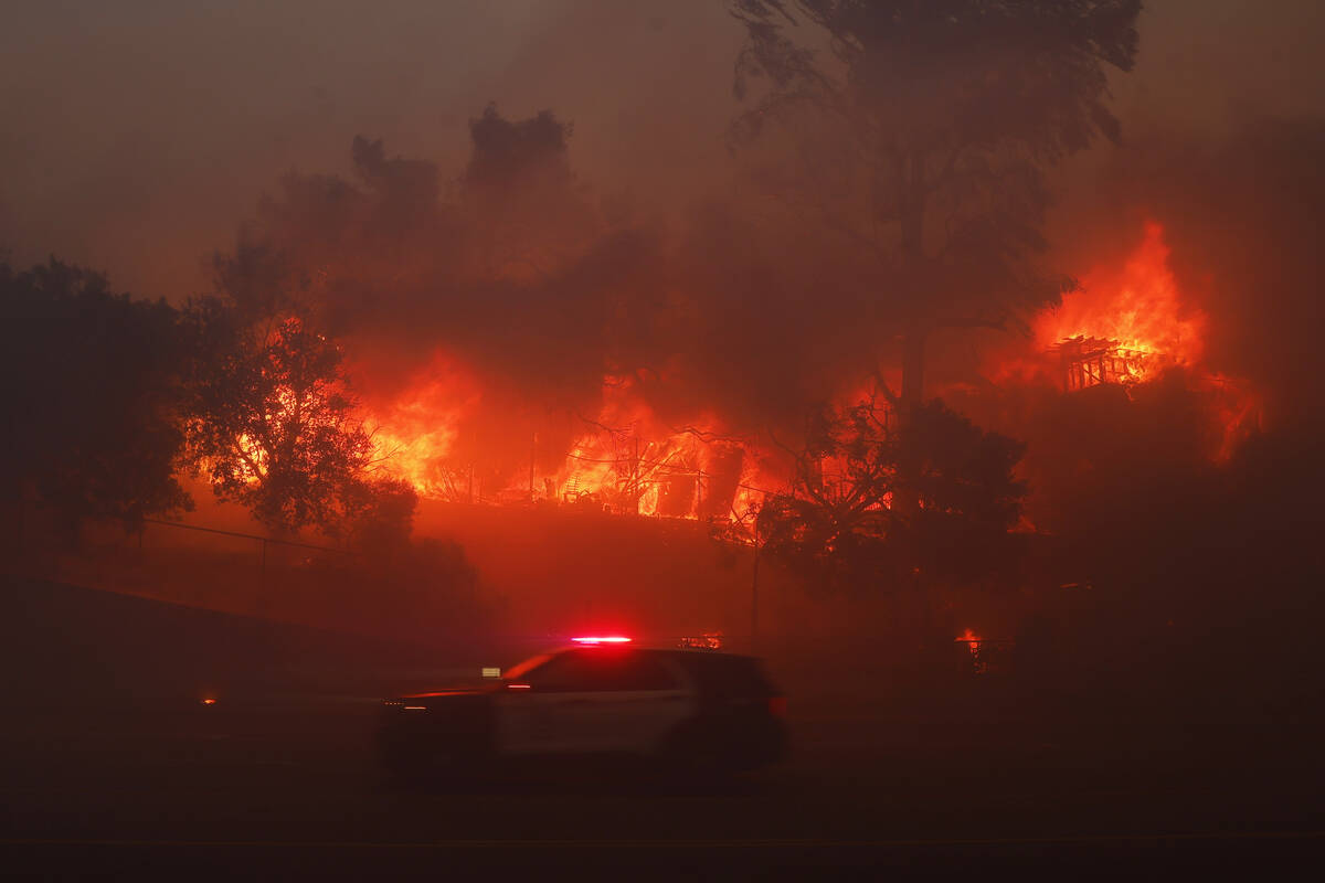 The Palisades Fire burns a property in the Pacific Palisades neighborhood of Los Angeles, Tuesd ...