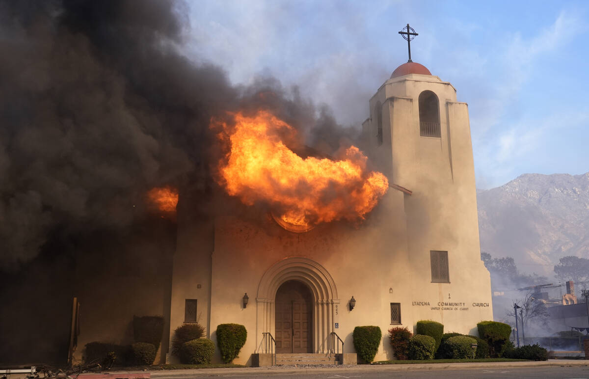 Fire explodes out of a window of the Altadena Community Church, Wednesday, Jan. 8, 2025, in the ...