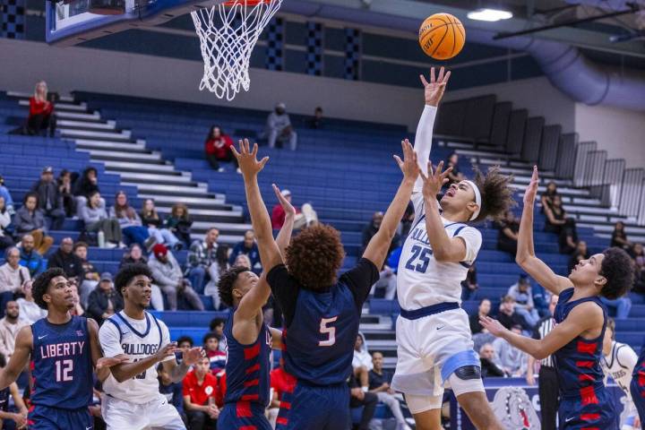 Centennial's Jayonni Durrough (25) shoots over Liberty's Dante Steward (5) during the first hal ...