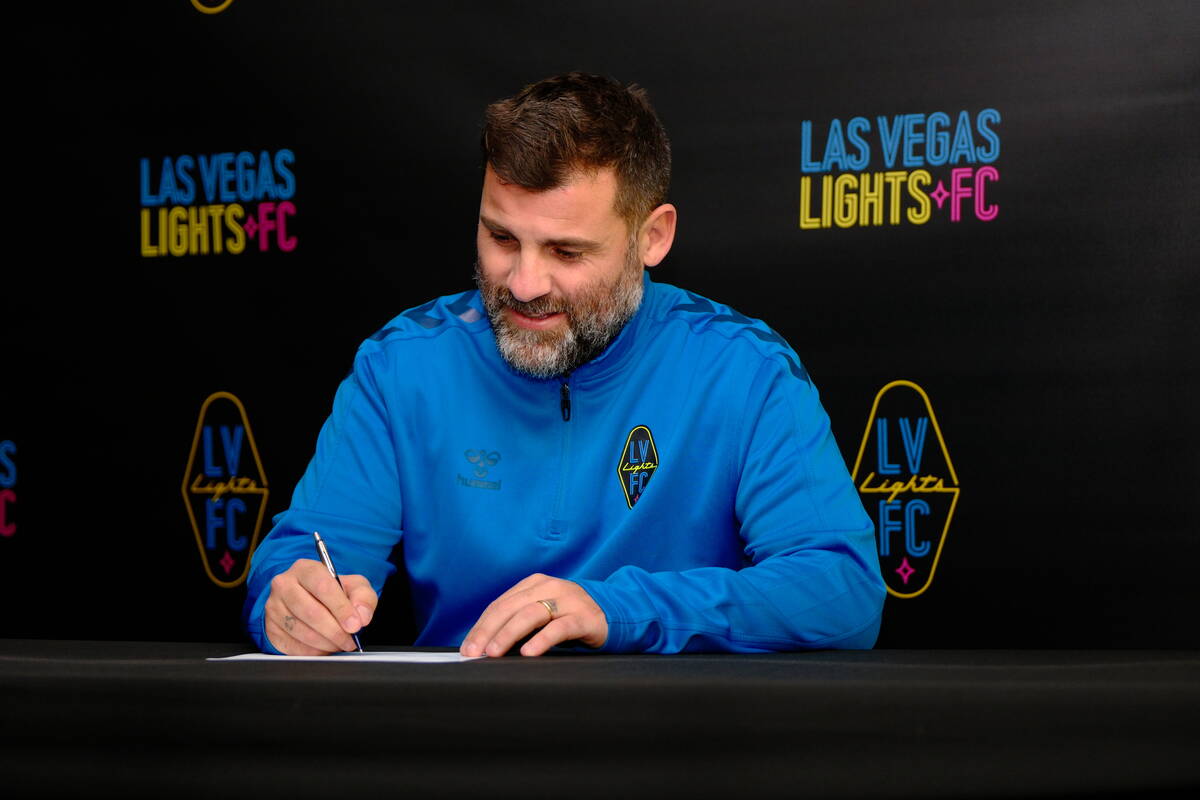 New Lights FC coach Antonio Nocerino signs his contract with the team. (Lights FC)