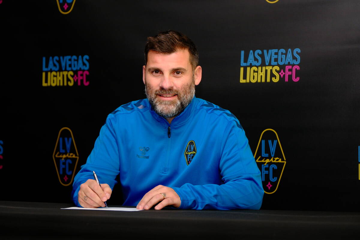 New Lights FC coach Antonio Nocerino signs his contract with the team. (Lights FC)