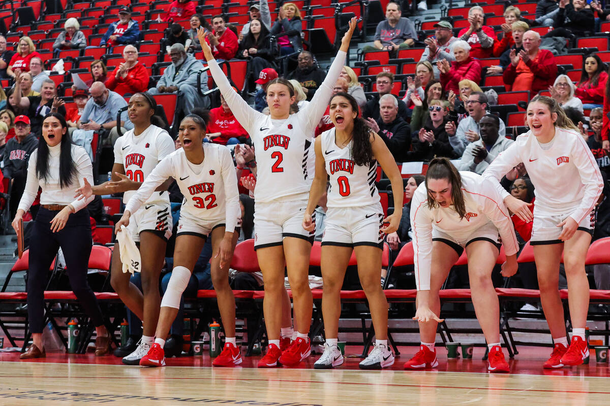 The Lady Rebels bench celebrates during an NCAA women’s basketball game between UNLV and ...