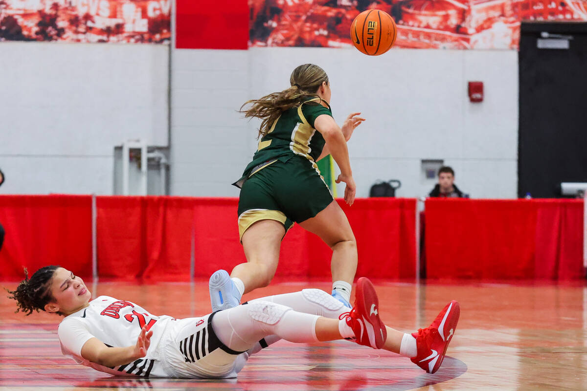 Colorado State Rams guard Brooke Carlson (2) chases a loose ball after Lady Rebels forward McKi ...