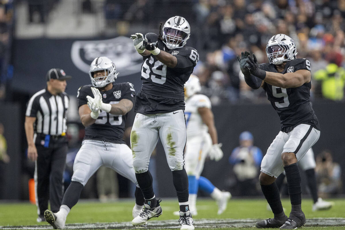 Raiders defensive tackle Adam Butler (69) celebrates his sack of Los Angeles Chargers quarterba ...