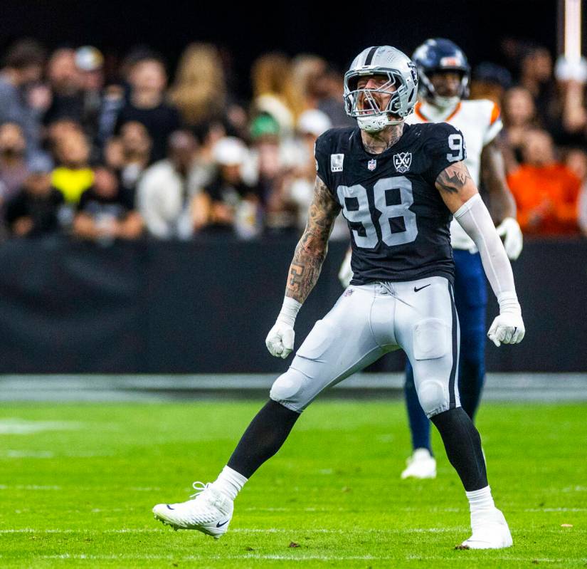 Raiders defensive end Maxx Crosby (98) celebrates a Denver Broncos defensive stop during the fi ...