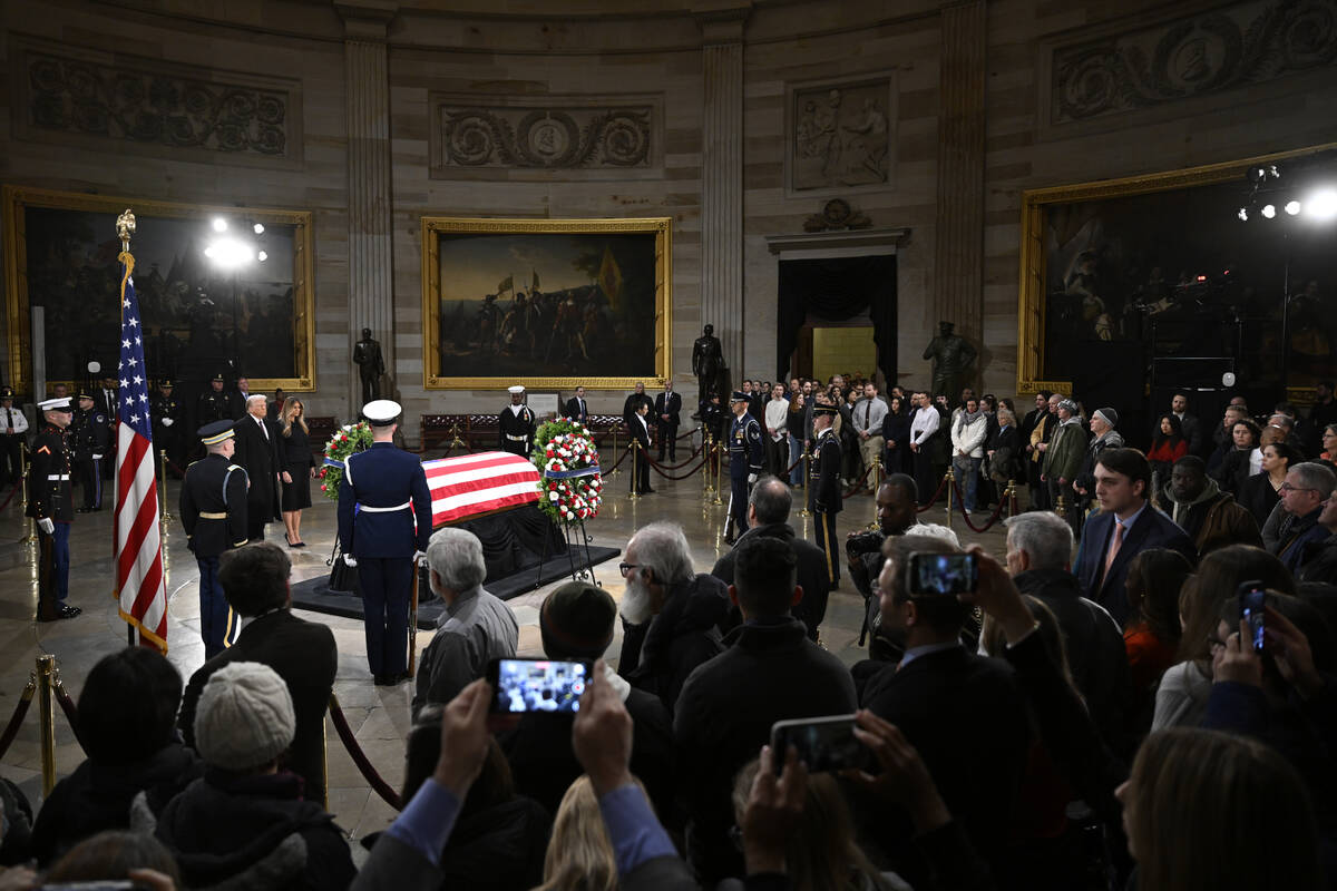 President elect Donald Trump and his wife Melania Trump visit the flag draped casket of the lat ...