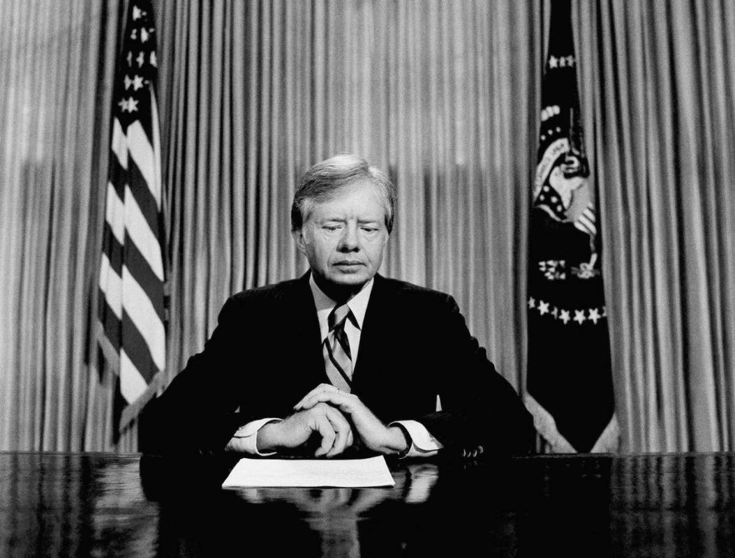 FILE - President Jimmy Carter prepares to make a national television address from the Oval Offi ...