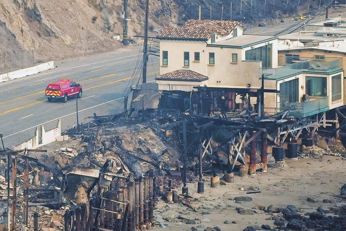 Beach front properties are left destroyed by the Palisades Fire, in this aerial view, Thursday, ...