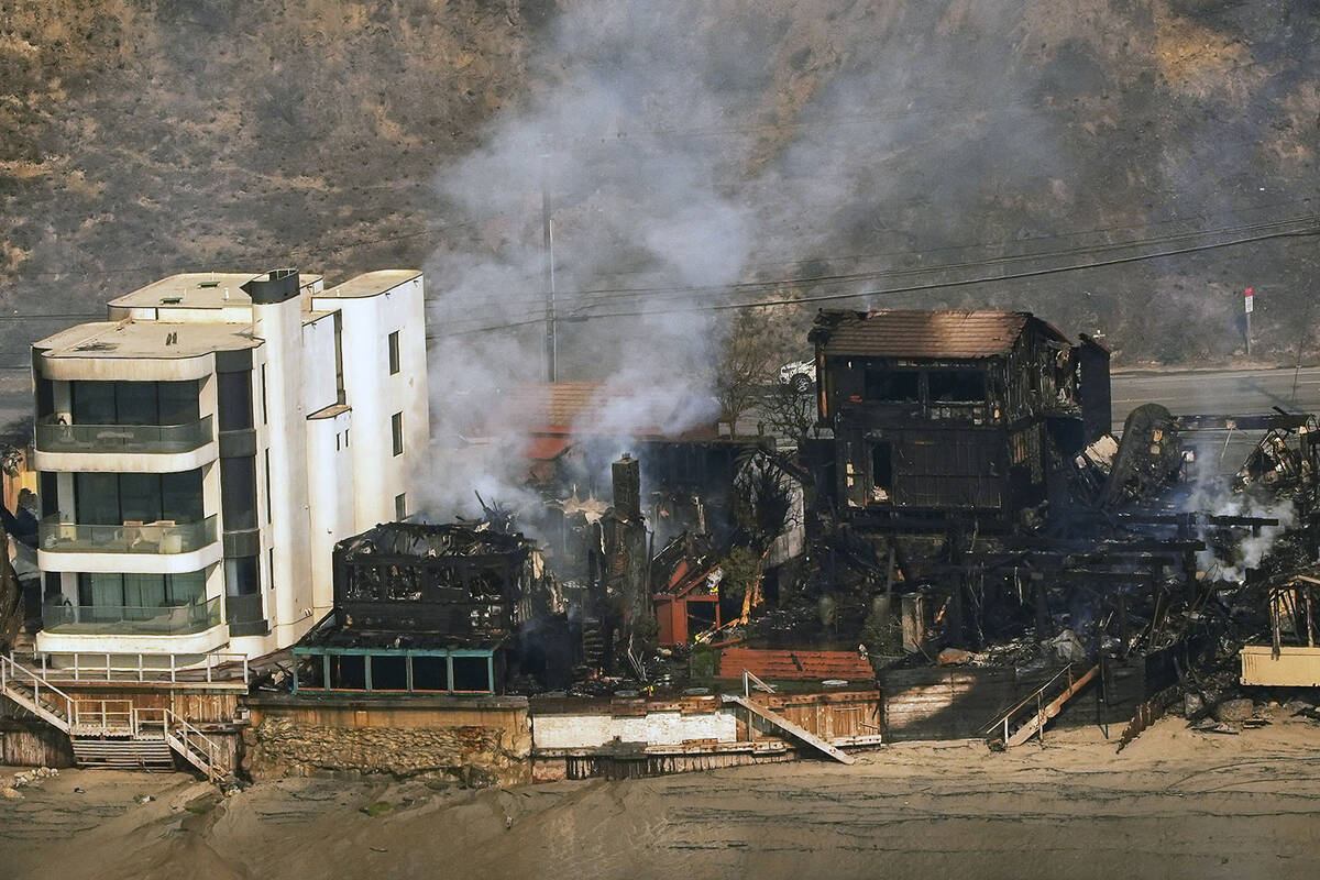 Beach front properties are left destroyed by the Palisades Fire, in this aerial view, Thursday, ...