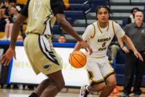 Sierra Vista point guard EJ Dacuma (0) dribbles the ball during a high school boys basketball g ...