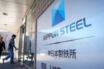 FILE - A staff enters doorway next to Nippon Steel logo at the company's Kashima Plant in Kashi ...