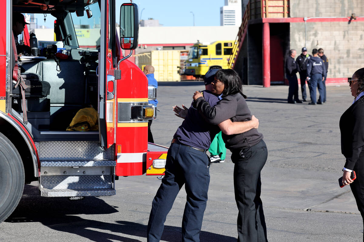 Las Vegas Fire and Rescue Deputy Chief Queen Anunay hugs a firefighter before a second strike t ...