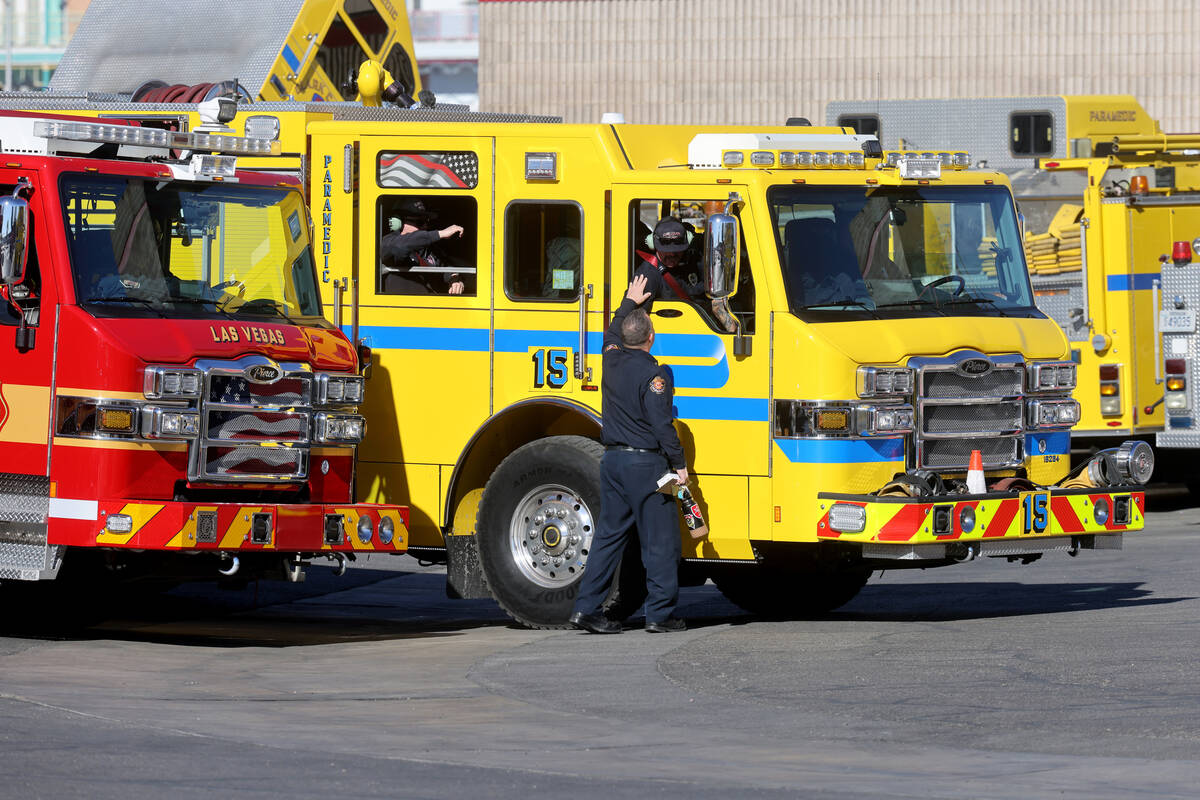 Firefighters from Clark County Fire Department and Las Vegas Fire and Rescue prepare to leave t ...